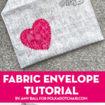 gray and pink fabric envelope on gray carpet