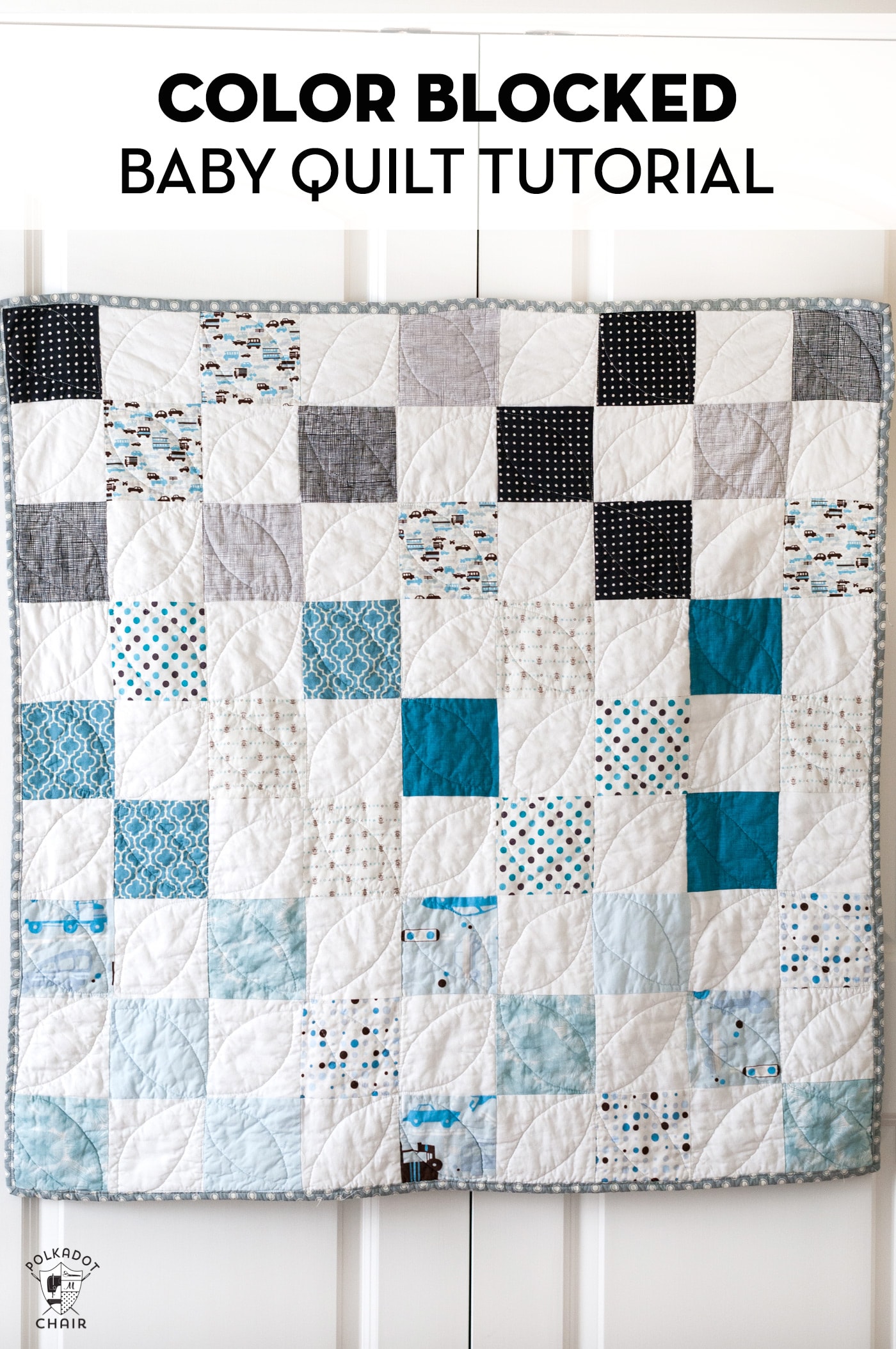 blue white and gray baby quilt on door