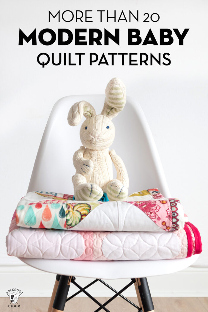 stack of quilts on chair with bunny in foreground