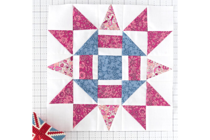 blue pink and white quilt block on white cutting mat