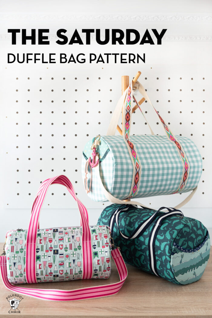 3 duffle bags on pegs in front of white wall