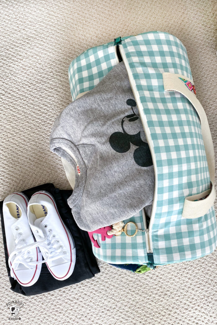 duffle bag on floor with sweatshirt