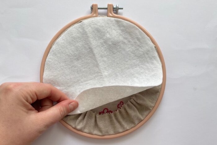 back of embroidery hoop with white felt