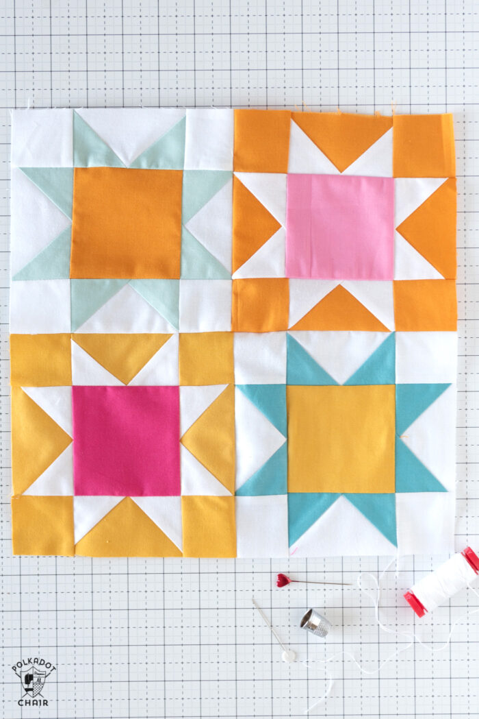 brightly colored quilt blocks on white cutting mat