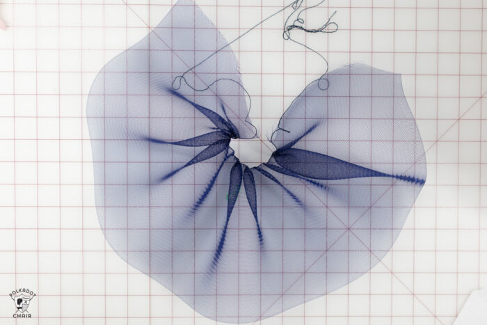 navy tulle on white cutting mat