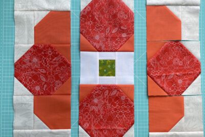 patchwork flower in pieces on cutting mat