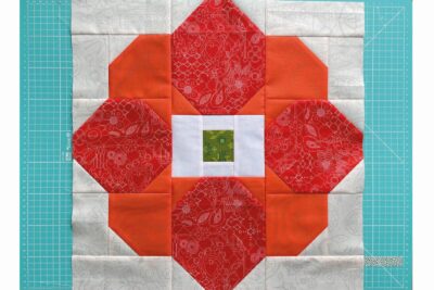 patchwork flower in pieces on cutting mat