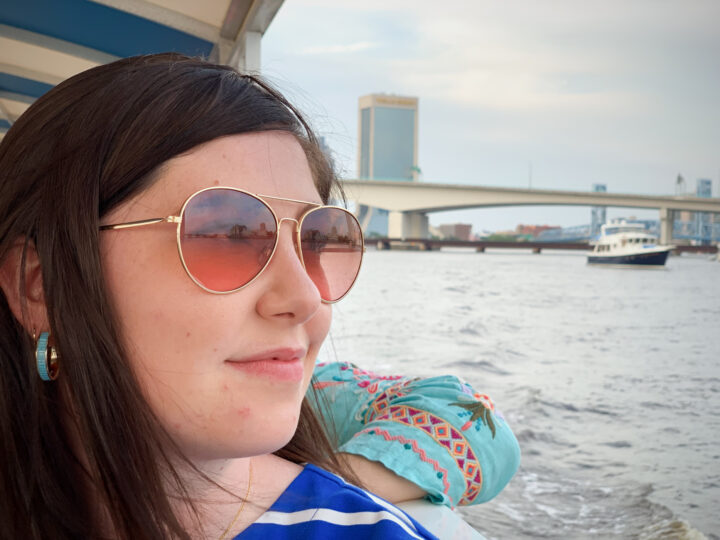 woman looking out at water on boat