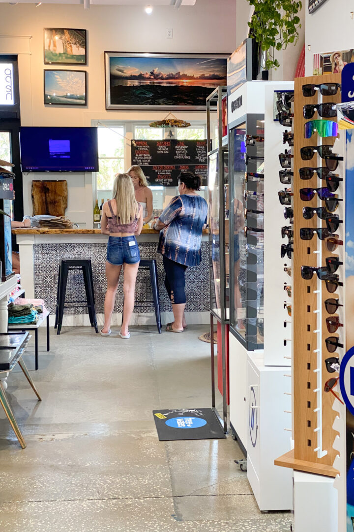 3 people inside shop