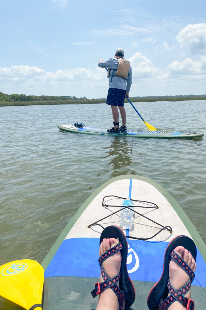 two people paddleboarding