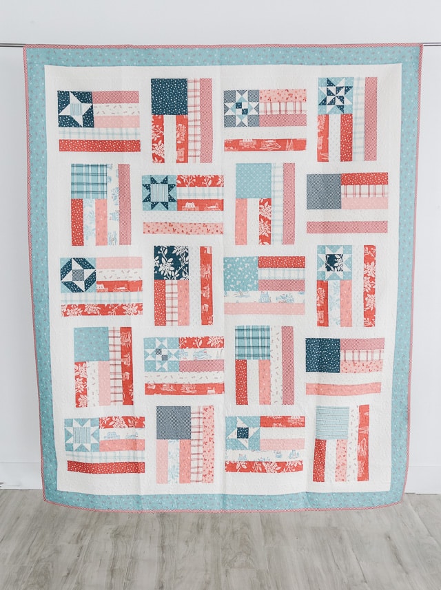 red white and blue flag quilt on wall