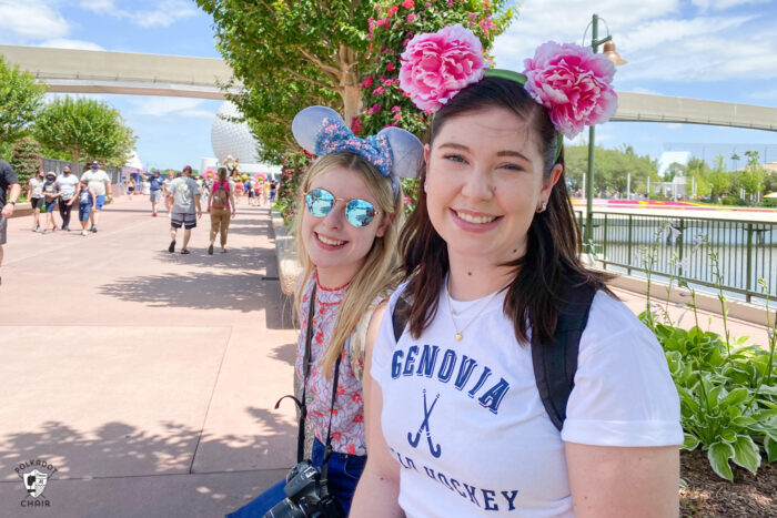 two girls on bench inside Epcot