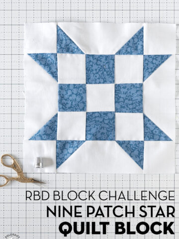 blue and white geometric quilt block on white cutting mat