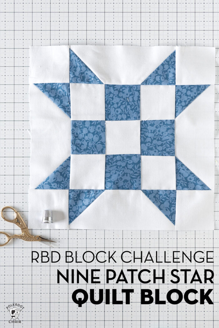 blue and white geometric quilt block on white cutting mat