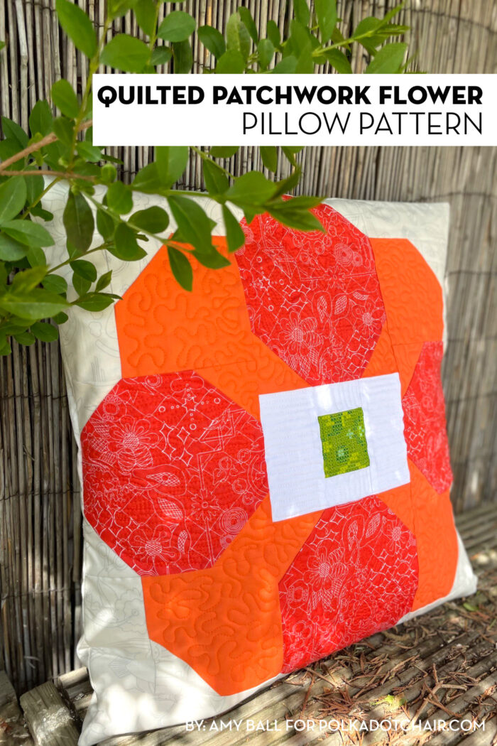 photo of orange and cream quilted pillow outdoors