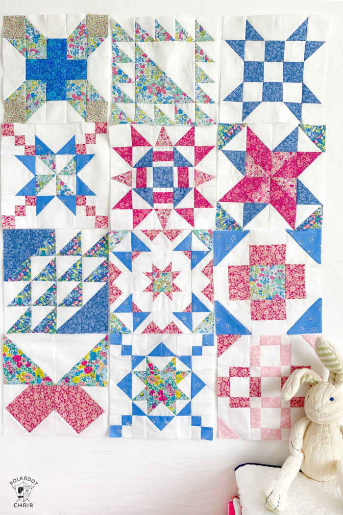 pink, white and blue quilt blocks on white wall