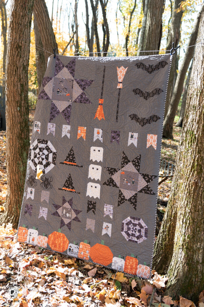 halloween quilt hanging outdoors.