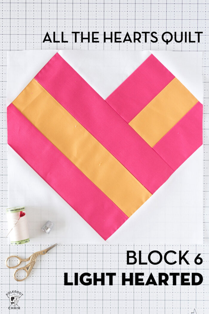 red, white and pink & yellow quilt block on cutting mat