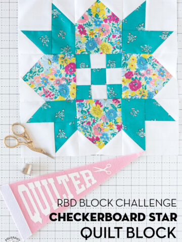 turquoise, white and floral quilt block on white cutting mat