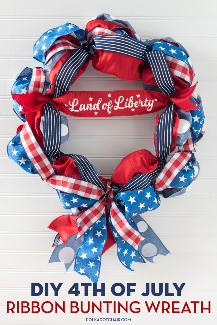 red, white and blue ribbon wreath on white wall