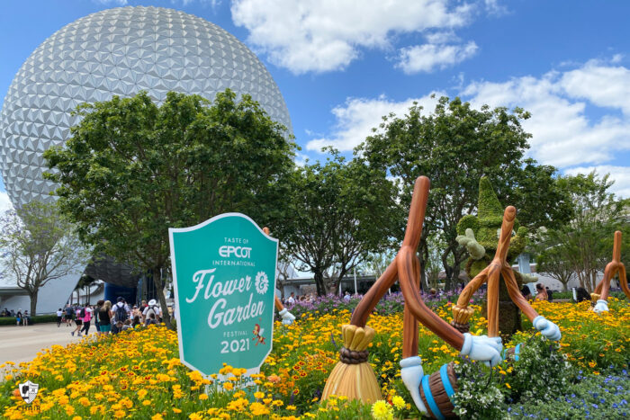 epcot dome with flowers in foreground