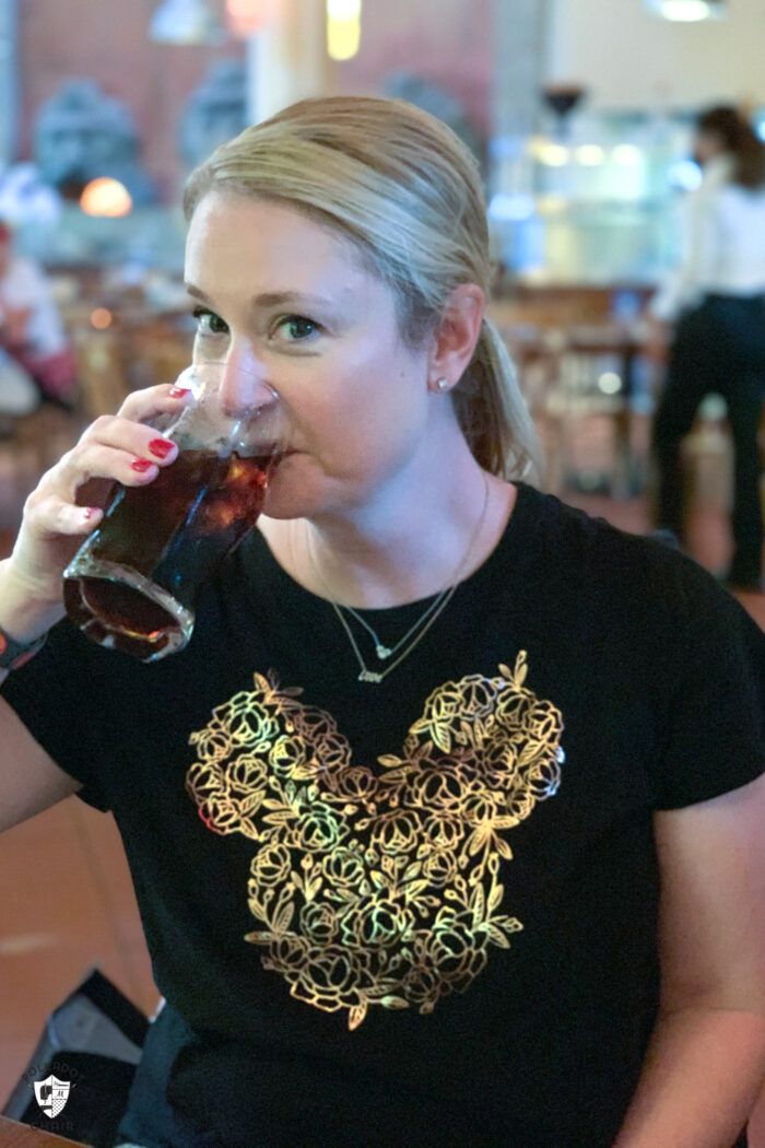 woman drinking a soda at via napoli