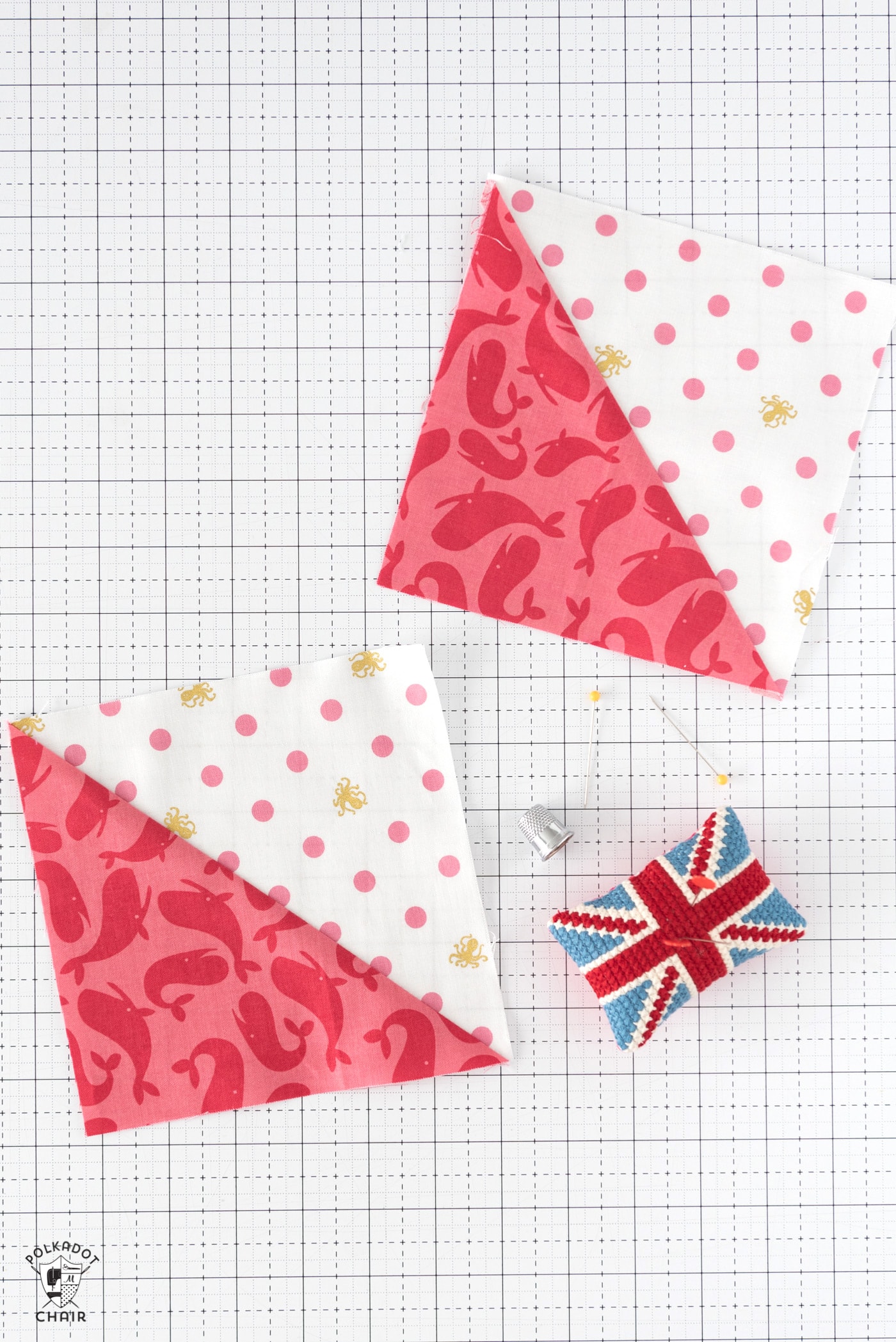 pink and white quilt blocks on white cutting mat