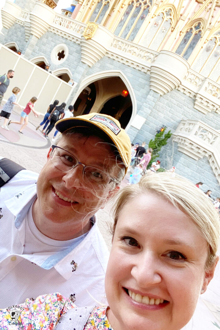 couple in front of castle in disney world