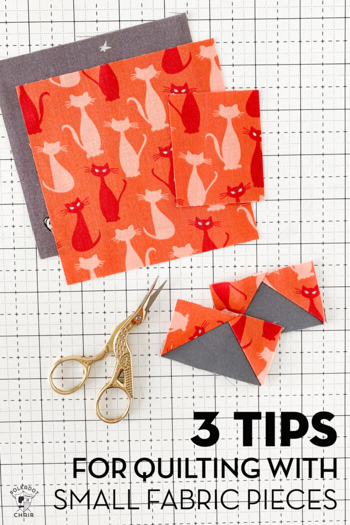 orange and gray quilt blocks with scissors on white cutting mat