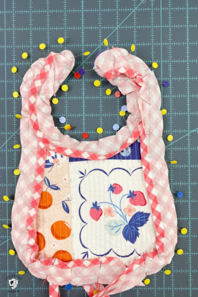 Bias pinned to baby bib