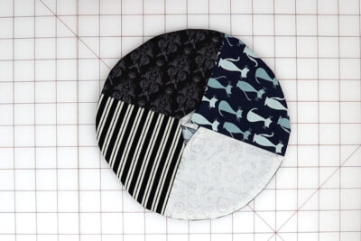 fabric circles on white cutting mat