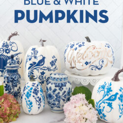 a collection of blue and white pumpkins on a white counter top with flowers