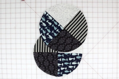 fabric circles on white cutting mat