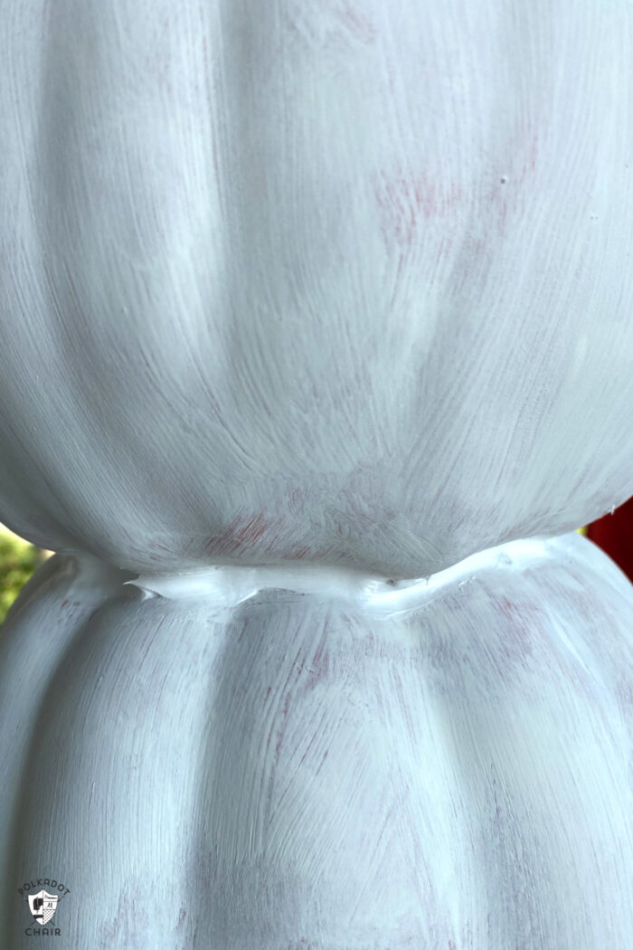 close up of caulking on faux pumpkins