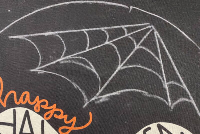 chalk spider web on black fabric