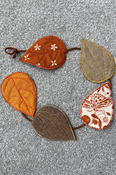 fabric leaves on gray carpet