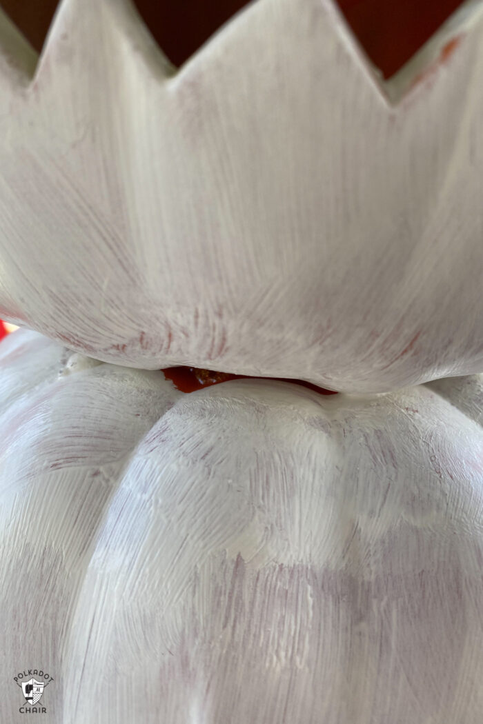 close up of white paint on pumpkins