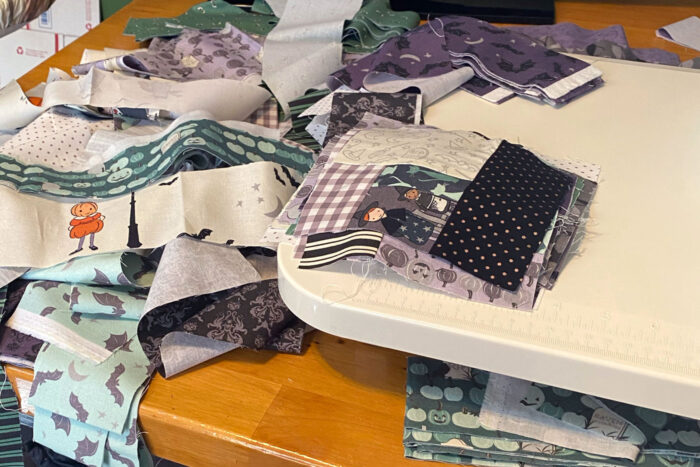 scraps of fabric on sewing machine table