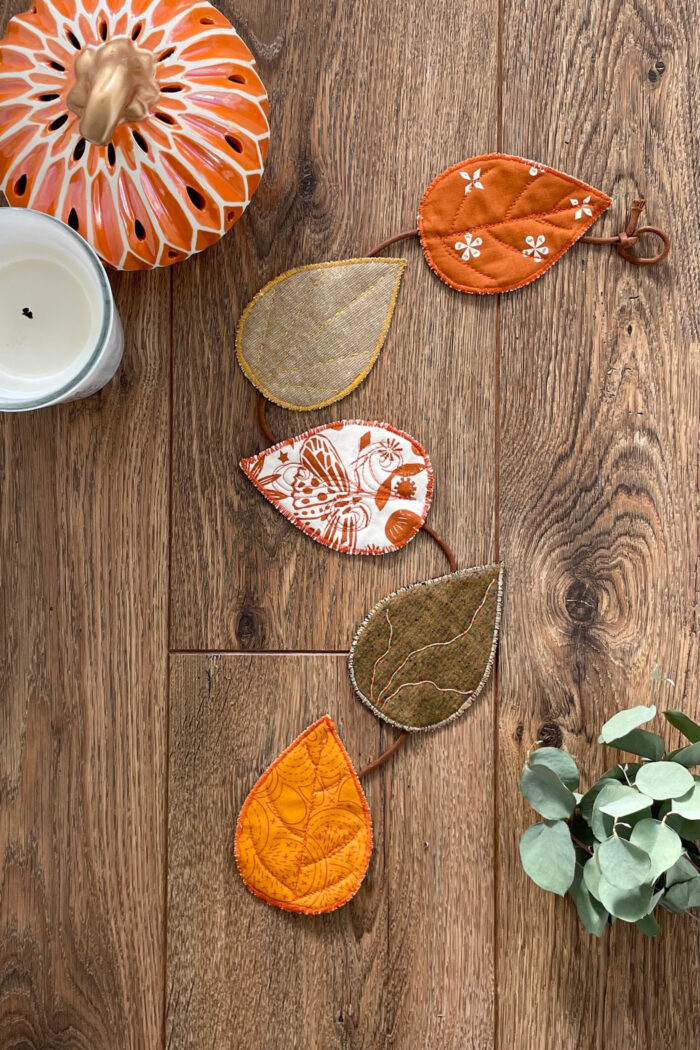 fabric leaves on brown wood tabletop