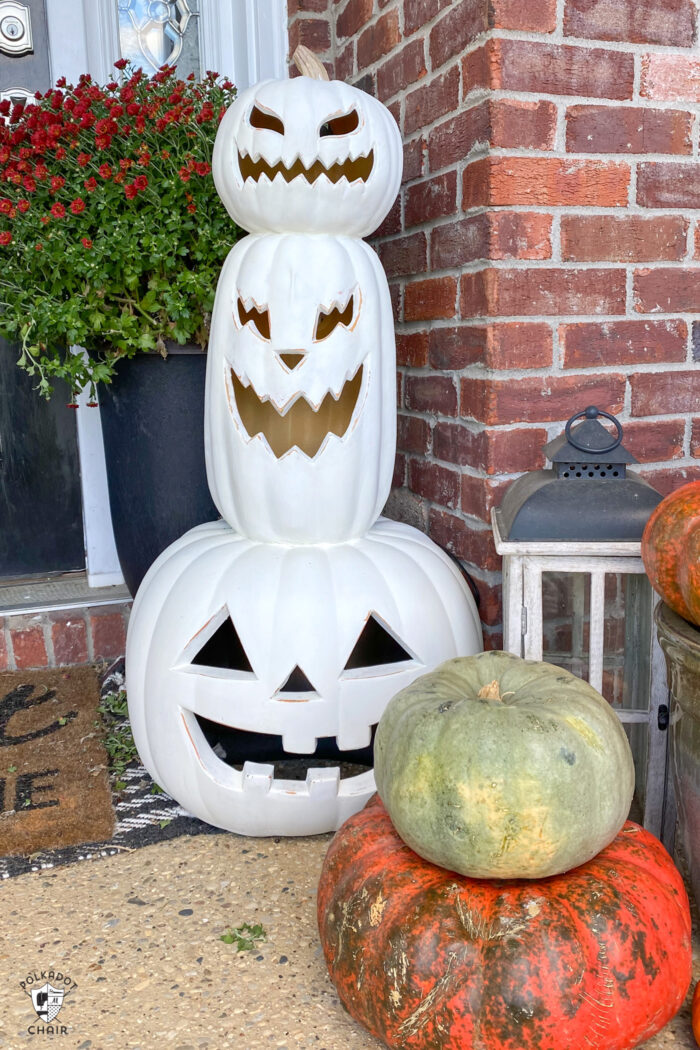 stack of white painted pumpkins