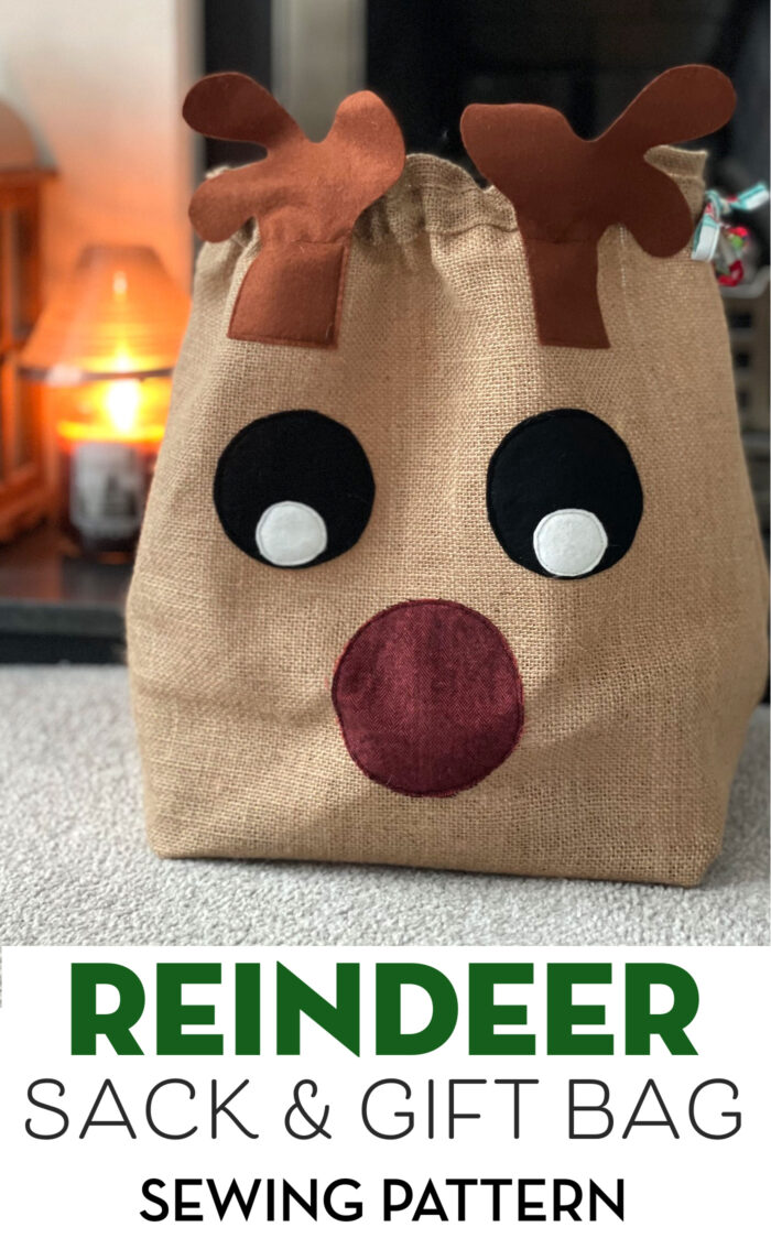 Burlap reindeer sack on table in front of candle