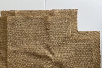 cut burlap fabric on white table