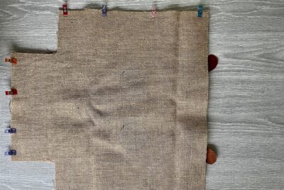 two pieces of burlap fabric pinned together