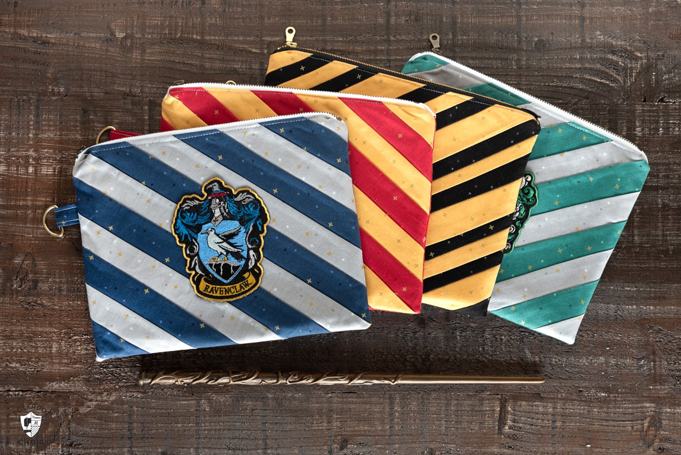 four striped pouches on wood table with harry potter wand