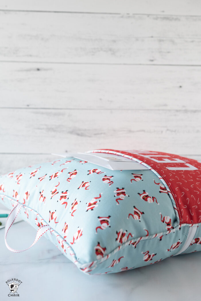 red and turquoise reading pillow on white background with "letters to santa" lettering on front