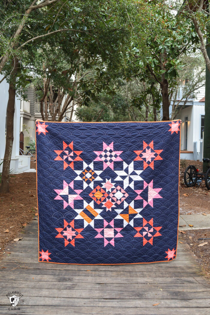 Navy, pink and orange modern star quilt outside