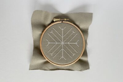 white stitching on tan embroidery fabric