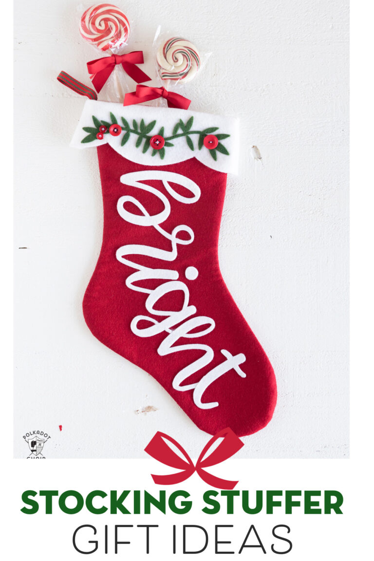red and white christmas stocking on white table with candy