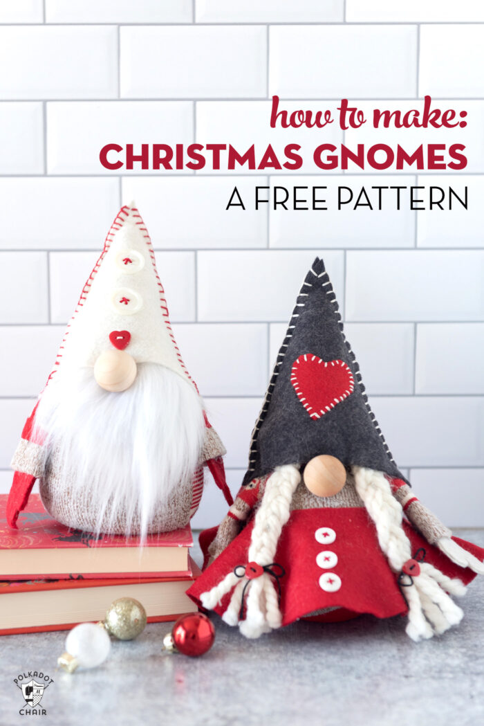 Red & gray stuffed Christmas gnomes on white countertop with books