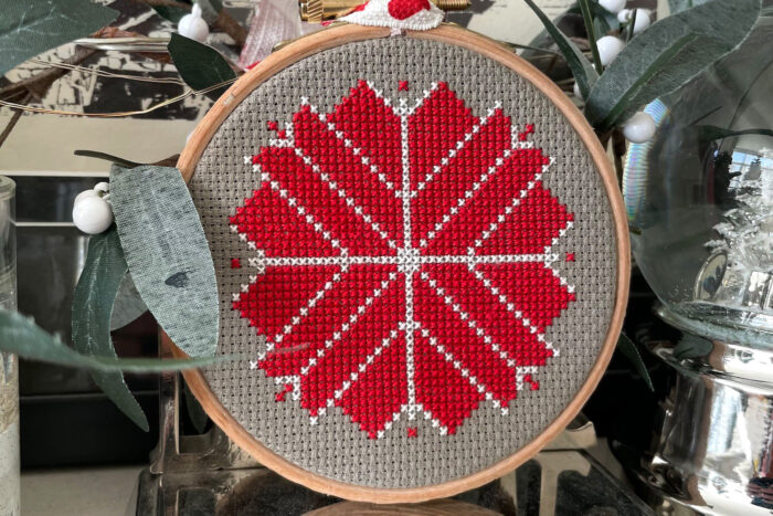 red, white and gray christmas ornament hanging on christmas tree